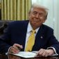 U.S. President Donald Trump signs an executive order in the Oval Office of the White House in Washington, D.C., U.S., March 7, 2025. REUTERS/Evelyn Hockstein